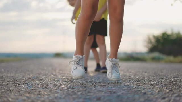 kids play classics hopscotch in the schoolyard. school kid a dream concept. playground children concept. kids jumping play on the asphalt hopscotch. game play fun outdoor