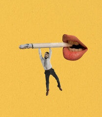 Young man balancing on smoking cigarette from woman's mouth isolated on yellow background....