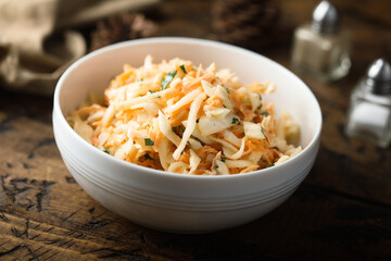 Traditional homemade coleslaw salad with fresh parsley