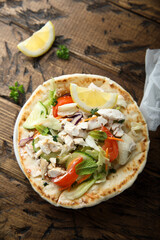 Fresh Greek pita bread with chicken and vegetables