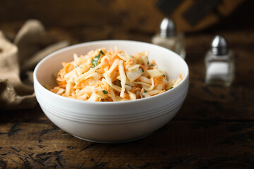 Traditional homemade coleslaw salad with fresh parsley
