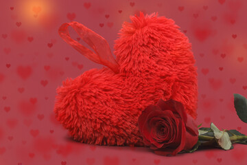 Valentine's Day background. Gift red heart and elegant rose on a red background. Valentine's Day concept.