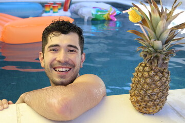 Natural looking young man in swimming pool