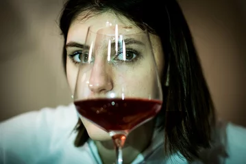 Fotobehang sad depressed alcoholic drunk woman drinking at home in housewife alcohol abuse and alcoholism. Alcoholic women with depression © MartaKlos