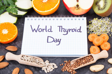 Notepad with inscription World Thyroid Day and best ingredients for healthy thyroid