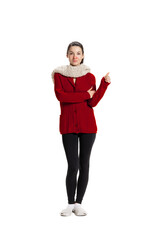 Front view of sad young girl feeling sick, has running nose wearing warm home clothes isolated over white studio background.