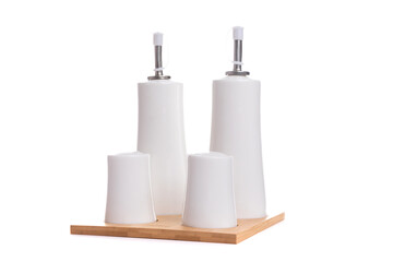 table set for seasonings, pepper and sugar bowl on a wooden stand on a white isolated background
