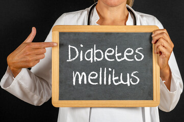 Doctor with a blackboard Diabetes mellitus written on it