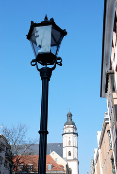 Lantern in the city of Leipzig with St Thomas church in background