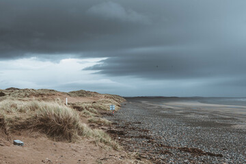 Storm clouds over an empty beach