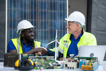 Engineer and workman discussion and design of alternative energy at the modern office,solar...