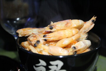 king prawns are hot, boiled seafood in a plate