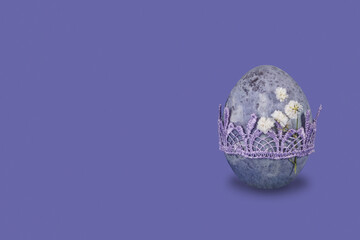 Vintage marble easter egg on very peri trendy background.