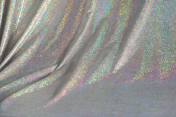 Abstract background of holographic rainbow fabric.