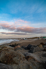 Beach of norre vorupor, denmark, sunset over old fishing boats