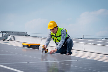 Engineer wearing unifrom and helmet inspect and check solar cell panel ,solar cell is ecology...