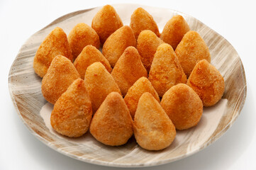 Typical Brazilian appetizer called Coxinha de Frango isolated on white background