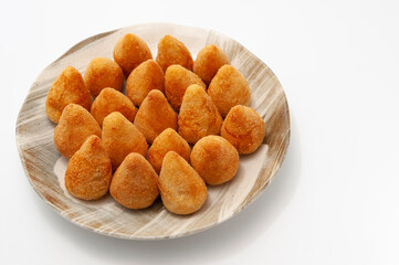 Typical Brazilian appetizer called Coxinha de Frango isolated on white background - Copy space.