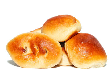 Fresh baked tasty sweet brioches, buns, loaves, bread isolated on white background