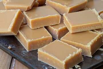 Close-up of homemade fudge squares on a baking sheet