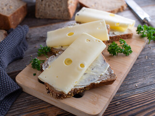 Cheese sandwich with emmental on buttered whole grain bread