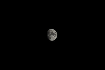 Moon isolated in dark night sky without visible stars