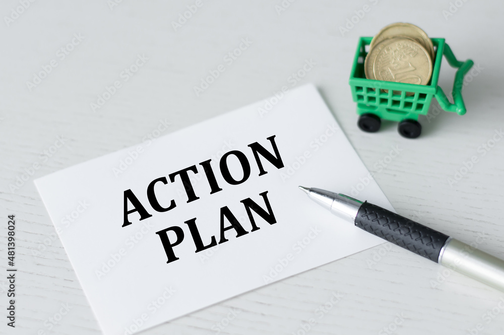 Poster action plan card with the text on the table next to the pen and corzine with manets