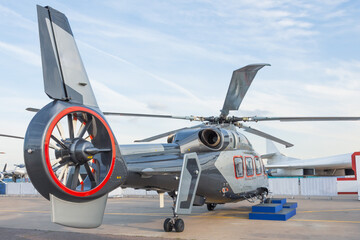 Helicopter tail with a propeller surrounded by a rigid frame.