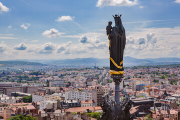Statue of Virgin Mary on top of Clermont Ferrand's cathedral in Auvergne France