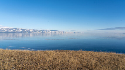 frozen lake and mountains in the winter