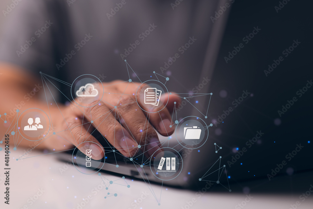 Aufkleber Businessman is using a computer to think about how to keep track of documents, how to keep records, how to keep files organized, how to access files, and more.