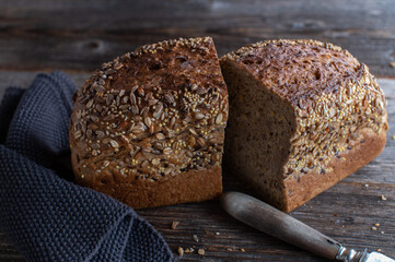 Loaf of bread on a wooden table.