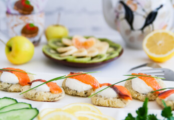 Cottage cheese pancakes with salt salmon appetizing.