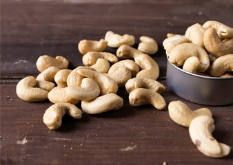 Cashew nuts isolated on wooden background