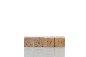 Wooden cubes with letters care on a white background