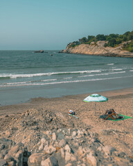 Couple with umbrella at Surfer's End, Middletown Rhode Island