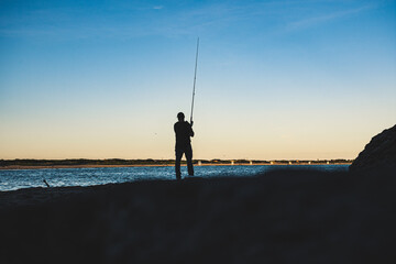 Fisherman casting at Second Beach, Rhode ISland