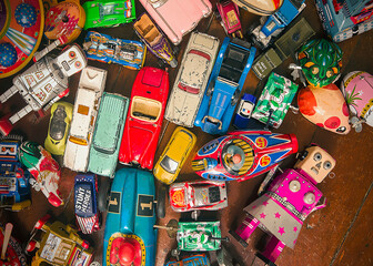Fototapeta na wymiar lots of vintage toys on a wooden floor