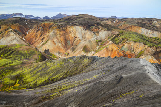 A ridge walking trail and the rugged volcanic landscape of Landmannalaugar, seen from the summit of Bl&aacute;hnj&uacute;kur volcano, Fjallabak Nature Reserve, Iceland