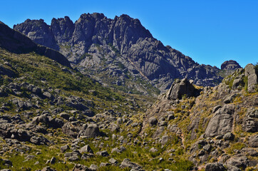 Agulhas Negras peak (2.791m), or Black Needles, one of the highest in Brazil, towering above the boulder-filled high sector of Itatiaia National Park, Itatiaia, Rio de Janeiro, Brazil