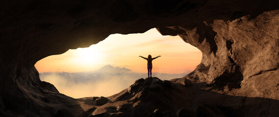 Dramatic Adventurous Scene with Woman standing inside a Rocky Cave Landcspae. 3d Rendering. Sunset...