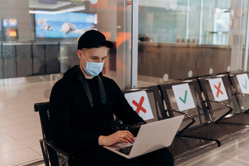 businessman who works in the airport wearing a mask 