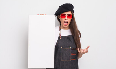 pretty hispanic woman looking angry, annoyed and frustrated. artist canvas concept