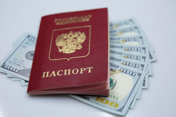 Russian passport with money of south-east Asia and American hundred dollar bill. Currency of Hong Kong, Indonesia, Malaysia, Thai, Singapore dollar. Travel concept. Exchange
