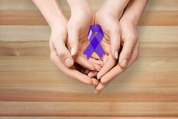 Blue ribbon cancer. Awareness prostate cancer of men health in November. Ribbon in hands