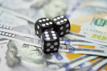 dollars with playing bones