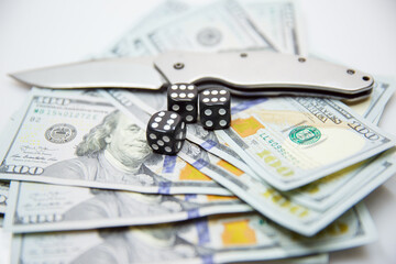 American dollars with a game bone and a knife