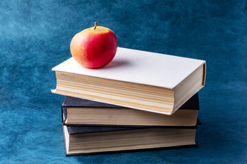 stack of books and apple
