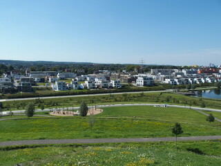 Obraz premium Park and houses at Lake Phoenix in the Dortmund suburb of Hoerde, North Rhine-Westphalia, Germany
