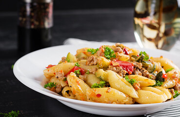 Conchiglie pasta. Italian pasta shells with minced meat, zucchini, tomato and sweet peppers.